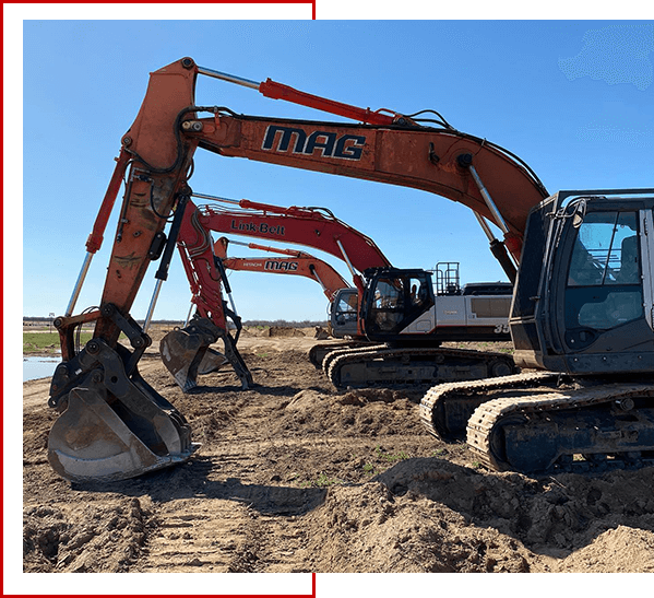 A group of excavators from mag engineering parked in the dirt.